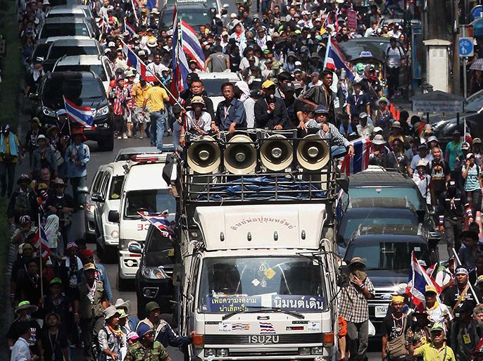 Thai anti-government protesters parade during a rally in Bangkok on February 3, 2014. Thai anti-government protesters vowed on February 3 to press on with street rallies aimed at ousting Prime Minister Yingluck Shinawatra after a disrupted election failed to cut a path through the kingdom's political crisis. AFP