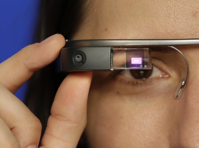 Associated Press Technology Writer Barbara Ortutay wears Google Glass in New York, Friday, Feb. 21, 2014. (AP Photo/Seth Wenig)
