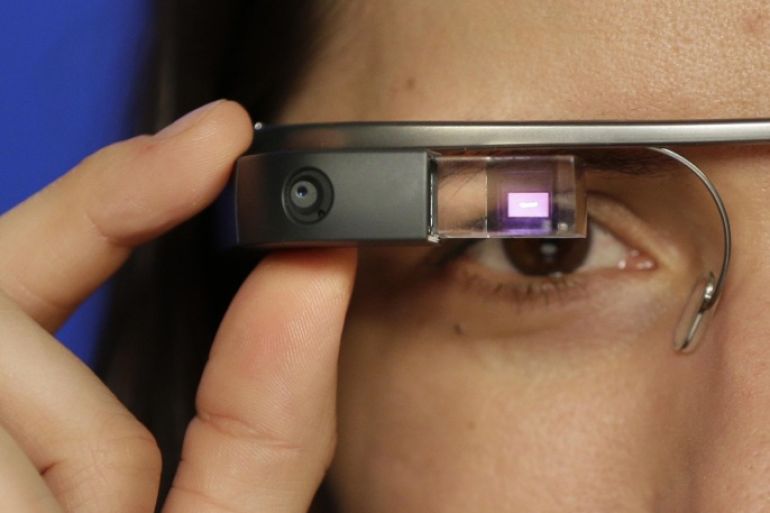Associated Press Technology Writer Barbara Ortutay wears Google Glass in New York, Friday, Feb. 21, 2014. (AP Photo/Seth Wenig)
