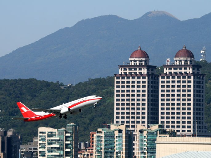 epa03972689 A Shanghai Airlines Boeing 737-800 passenger jet takes off from the