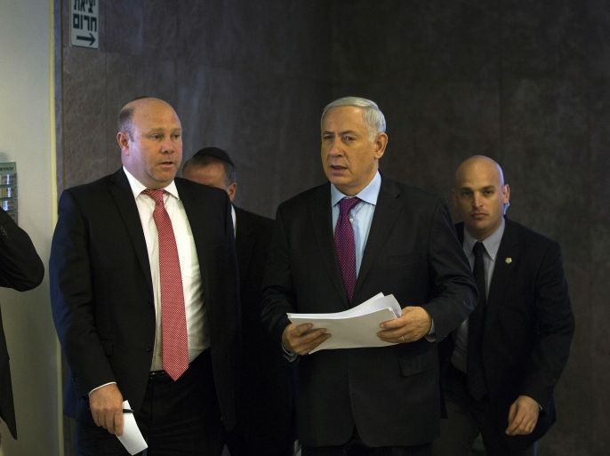 Israel's Prime Minister Benjamin Netanyahu, second right, arrives for the weekly cabinet meeting at his office in Jerusalem, Sunday, February 23, 2014. (AP Photo/Ronen Zvulun, Pool)