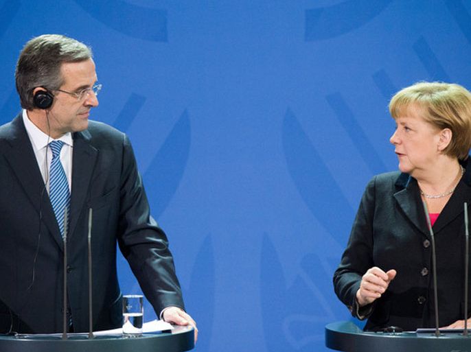 epa03961219 Greek Prime Minister Antonis Samaras (L) and German Chancellor Angela Merkel (R) give a press conference at the Federal Chancellery in Berlin, Germany, 22 November 2013. Negotiations between Greece and international lenders on more aid for the eurozone's most battered economy will 'not be such an easy job,' German Chancellor Angela Merkel said 22 November. EPA/MAURIZIO GAMBARINI
