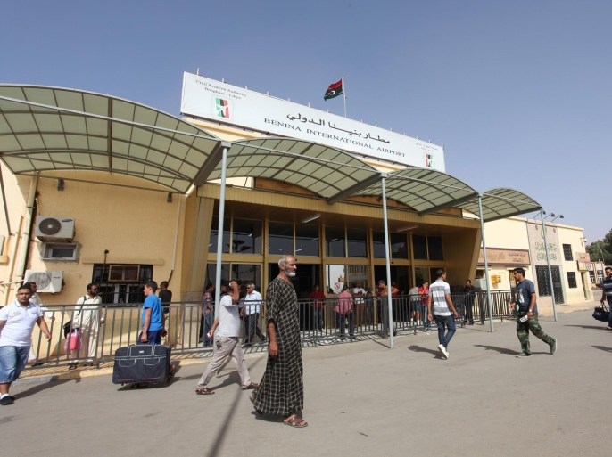 Libyans walk toward the departure hall in Benghazi airport, in Libya, Friday, Sept. 14, 2012. President Mohammed el-Megarif , said during his visit to the U.S. Consulate that Benghazi airport been closed to prevent any attackers to flee the city. (AP Photo/Mohammad Hannon)