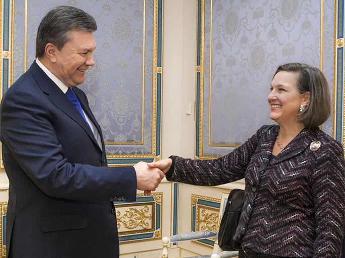 Ukraine's President Viktor Yanukovych, left, greets U.S. Assistant Secretary for European and Eurasian Affairs Victoria Nuland in Kiev, Ukraine, Thursday, Feb. 6, 2014. The senior U.S. diplomat has arrived in the Ukrainian capital to try to help find a resolution to the protests and political crisis that have gripped the country for more than two months. Nuland is on a two day visit to Kiev. (AP Photo / Mykhailo Markiv, Pool)