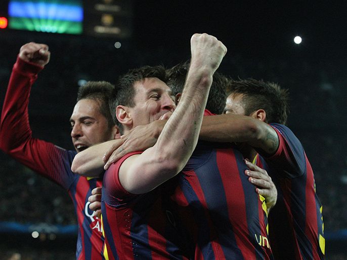 Barcelona's Argentinian forward Lionel Messi (2nd L) celebrates with his teammates after scoring during the UEFA Champions League round of 16 second leg football match FC Barcelona vs Manchester City at the Camp Nou stadium in Barcelona on March 12, 2014. AFP