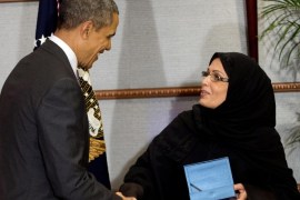 U.S. President Barack Obama presents Dr. Maha Al-Muneef with the U.S. Secretary of State's International Woman of Courage Award in Riyadh, Saudi Arabia, Saturday, March 29, 2014. Dr. Al-Muneef, founder and Executive Dir. of the National Family Safety Program (NFSP), was unable to attend the award ceremony in the U.S. this past March and was presented the award during Obama's visit to Saudi Arabia.(AP Photo/Pablo Martinez Monsivais)