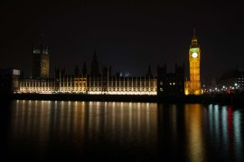 This combination picture taken on March 29, 2014 shows the Houses of Parliament in central London illuminated as normal (L) and with the lights out to mark Earth Hour (R). Britain’s Houses of Parliament will go dark
