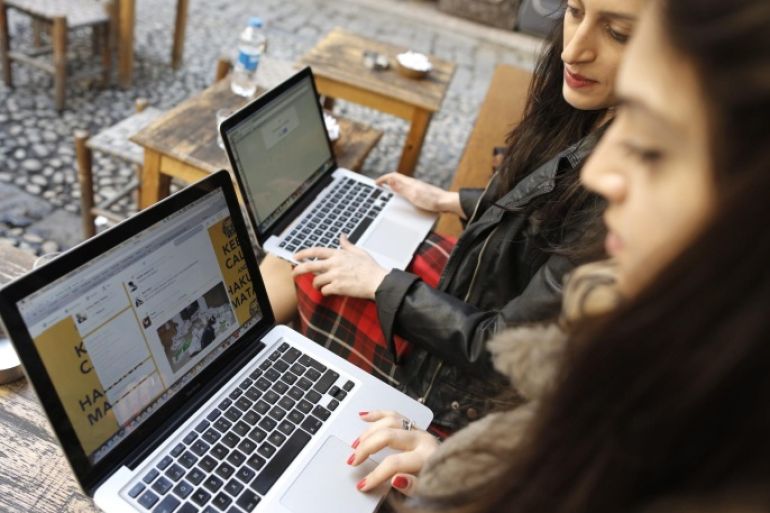 Two Turkish women try to get connected to the twitter web site with their laptops at a cafe in Istanbul, Turkey 21 March 2014. The social media site Twitter was blocked in Turkey early on 21 March 2014, amid an internet crackdown in the country. Some users said they could not load the site, while others were being redirected to an official website saying a court order was applying 'protection measures.'The move came just hours after Turkish Prime Minister Recep Tayyip Erdogan promised to 'root out' Twitter, after pushing through new legislation last month which allows authorities to shut down websites and track users' browsing histories.