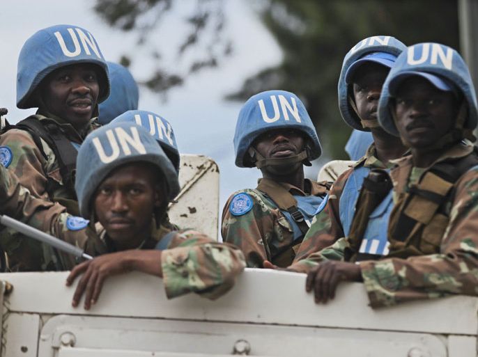 epa03483924 United Nations (UN) Peacekeepers from South Africa are seen aboard an armored truck in Goma, eastern Democratic Republic of Congo, 2D3 November 2012. The M23 rebels repeled an attack by the Congolese government forces in the town of Sake, forcing the government troops to pull back and retreat to Minova. Tens of thousands of residents fled Sake and surrounding areas after the heavy fighting the previous day. The number of IDPs (Internally Displaced Person) has drastically increased at a roadside IDP camp between Sake and Goma. EPA/DAI KUROKAWA