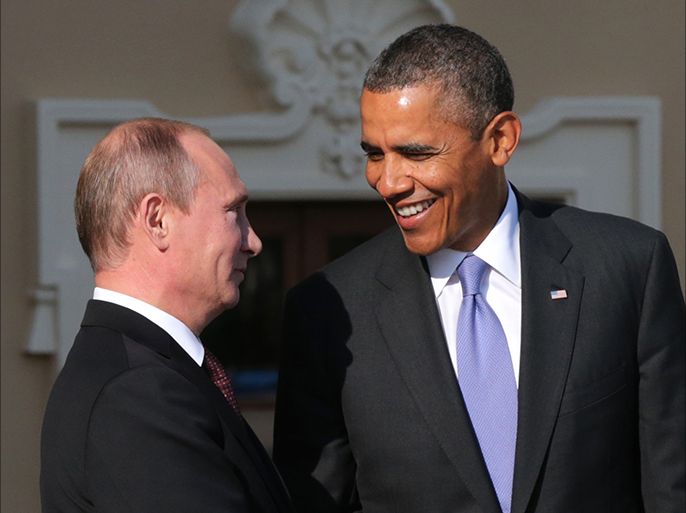 epa03863812 (FILE) A file photo dated 05 September 2013 shows Russian President Vladimir Putin (L) and US President Barack Obama (R) exchanging smiles as the latter arrives for the first session of G20 summit in St. Petersburg, Russia. Russian President Vladimir Putin issued a warning 'directly to the American people' late 11 September 2013, that military intervention in Syria could destabilize the region and damage 'an entire system of international law. A strike would increase violence and unleash a new wave of terrorism,' Putin wrote in the New York Times, arguing that it could also undermine talks on Iran's nuclear programme, and negotiations between Israel and the Palestinians. Putin's article was published online ahead of talks due later on 12 September in Geneva, Switzerland, between US Secretary of State John Kerry and Russian Foreign Minister Sergei Lavrov, to