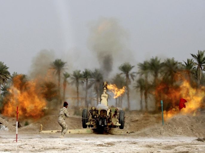 A member of Iraqi security forces fires a cannon during clashes with the al Qaeda-linked Islamic State in Iraq and the Levant (ISIL) in Jurf al-Sakhar south of the Iraqi capital Baghdad, March 19, 2014. Six members of ISIL were killed and 15 others were arrested during clashes that erupted between the Iraqi military forces and ISIL in Jurf al-Sakhar south of the Iraqi capital Baghdad, according to an Iraqi Army officer. REUTERS/Alaa Al-Marjani (IRAQ - Tags: CIVIL UNREST POLITICS CONFLICT TPX IMAGES OF THE DAY)