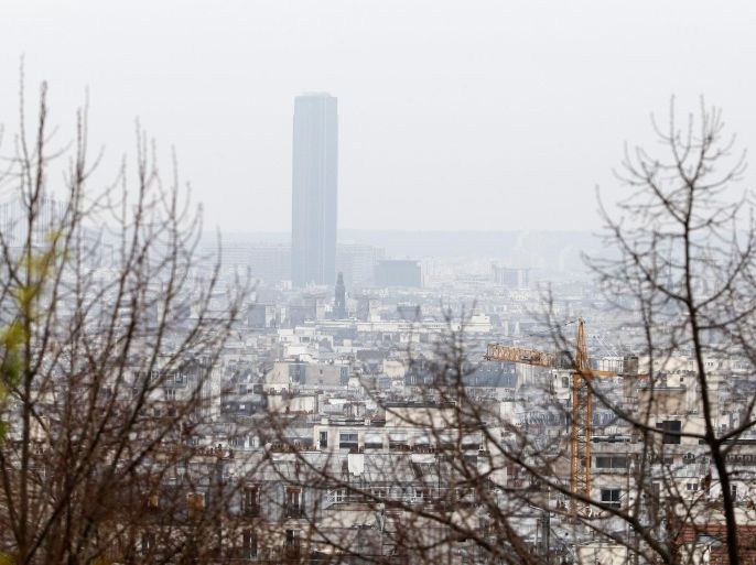 A general view shows the Montparnasse Tower and the Paris skyline from the Parc de Belleville in Paris March 17, 2014. France deployed hundreds of police in Paris on Monday to enforce the most drastic curbs on car use in 20 years as authorities sought to reduce health-endangering pollution days before town hall elections. Amid concerns of a worsening air quality after a week when unseasonally balmy weather boosted pollution, public transport was free of charge while drivers with even-numbered licence plates were told to leave their cars at home of face fines. REUTERS/Charles Platiau (FRANCE - Tags: TRANSPORT ENVIRONMENT)