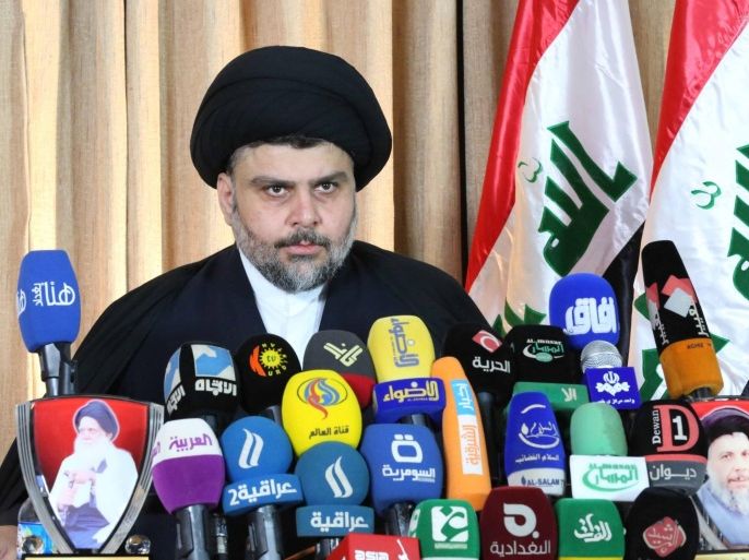 Shi'ite Muslim cleric Moqtada al-Sadr speaks in Najaf, 160 km (99 miles) south of Baghdad, February 18, 2014. Sadr stuck to his decision to leave political life and dissolve his movement, saying that politics had become a way to inflict injustice. Sadr, who led revolts against U.S. forces in Iraq before their pullout and became a major influence in the government, initially announced his retirement on Saturday via a handwritten statement on his website. REUTERS/Handout/Office of Moqtada al-Sadr (IRAQ - Tags: POLITICS RELIGION) FOR EDITORIAL USE ONLY. NOT FOR SALE FOR MARKETING OR ADVERTISING CAMPAIGNS. THIS IMAGE HAS BEEN SUPPLIED BY A THIRD PARTY. IT IS DISTRIBUTED, EXACTLY AS RECEIVED BY REUTERS, AS A SERVICE TO CLIENTS