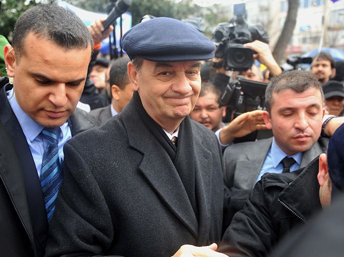 Turkey's former army chief Ilker Basbug (C) arrives on March 8, 2014 at Besiktas, in Istanbul to attend a "silence scream " campaign, organized by relatives of jailed army members . Basbug, who was jailed for life last year for plotting to overthrow the Islamic-rooted government, walked free from prison on March 7, 2014 after a court ordered his release. Basbug was initially detained in 2012 before being sentenced to life in prison in August 2013, along with hundreds of other military officers who were given long jail terms for their roles in the so-called "Ergenekon" conspiracy to overthrow the government. AFP
