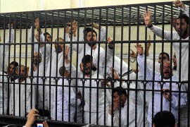 Supporters of former Egyptian president Mohamed Mursi, standing trial on charges of violence that broke out in Alexandria last year, react after two fellow supporters were sentenced to death, in a court in Alexandria, March 29, 2014. The Egyptian court on Saturday sentenced two supporters of former President Mohamed Mursi to death for committing murder during violence that broke out in Alexandria last year after the army deposed the Islamist head of state. The two men - Mahmoud Ramadan and Abdullah el-Ahmedi - were standing trial on charges that included throwing youths from the roof of a building in the Mediterranean city. REUTERS/Al Youm Al Saabi Newspaper (EGYPT - Tags: POLITICS CIVIL UNREST CRIME LAW TPX IMAGES OF THE DAY) ATTENTION EDITORS - FOR EDITORIAL USE ONLY. NOT FOR SALE FOR MARKETING OR ADVERTISING CAMPAIGNS. THIS IMAGE HAS BEEN SUPPLIED BY A THIRD PARTY. IT IS DISTRIBUTED, EXACTLY AS RECEIVED BY REUTERS, AS A SERVICE TO CLIENTS. EGYPT OUT. NO COMMERCIAL OR EDITORIAL SALES IN EGYPT