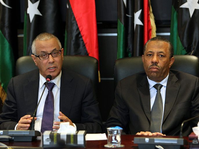 epa04120414 (FILE) A file photo dated 16 November 2013 shows Libyan Prime Minister Ali Zidan (L) and Libyan Minister of Defence Abdullah al-Thani (R) attending a press conference with members of the government, in Tripoli, Libya. Media reports on 11 March 2014 state the Libyan parliament passed a no-confidence vote against Prime Minister Ali Zidan after a tanker laden with oil from a rebel-held port broke through a naval blockade. The National Congress has appointed Defence Minister Abdullah al-Thani as acting premier for a period of 15 days. EPA