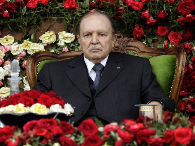 Algeria's President and head of the Armed Forces Abdelaziz Bouteflika attends a graduation ceremony of the 40th class of the trainees army officers at a Military Academy in Cherchell, west of Algiers, in this June 27, 2012 file photo. After months of speculation, the 77-year-old leader, who suffered a stroke in 2013, gave no live television or radio speech to declare his candidacy, leaving his prime minister and the state news agency to announce it last week. On March 3, 2014 Bouteflika registered at the Constitutional Council 24 hours before the deadline, appearing briefly on state television to speak in public for the first time in months. Another Bouteflika term would remove immediate uncertainty about the future of Algeria, a major African oil supplier and an ally in Washington's war on Islamist militants who have extended their roots in North Africathanks to chaos in next-door Libya. But for all the official insistence Bouteflika is in good shape, his scarce appearances have prompted doubts about how he will campaign, what happens if he falls ill and who succeeds him if his health forces him to step down in his fourth term. REUTERS/Ramzi Boudina (ALGERIA - Tags: POLITICS ELECTIONS)