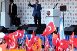 Turkey's Prime Minister Recep Tayyip Erdogan addresses the crowd during an election rally in Ankara March 22, 2014. Turkish Prime Minister Recep Tayyip Erdogan said on March 5 that he was ready to step down if his ruling party, in power since 2002, failed to win the key local elections which will be held on March 30. AFP PHOTO / ADEM ALTAN