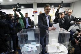 Serbian Progressive Party leader Aleksandar Vucic casts his ballot at a polling station in Belgrade, Serbia, Sunday, March 16, 2014. Serbs are voting in an early parliamentary election that is expected to tighten the grip on power of the ruling populists, who have become popular by promising to fight crime and corruption in the troubled Balkan nation seeking EU entry. (AP Photo/Darko Vojinovic)