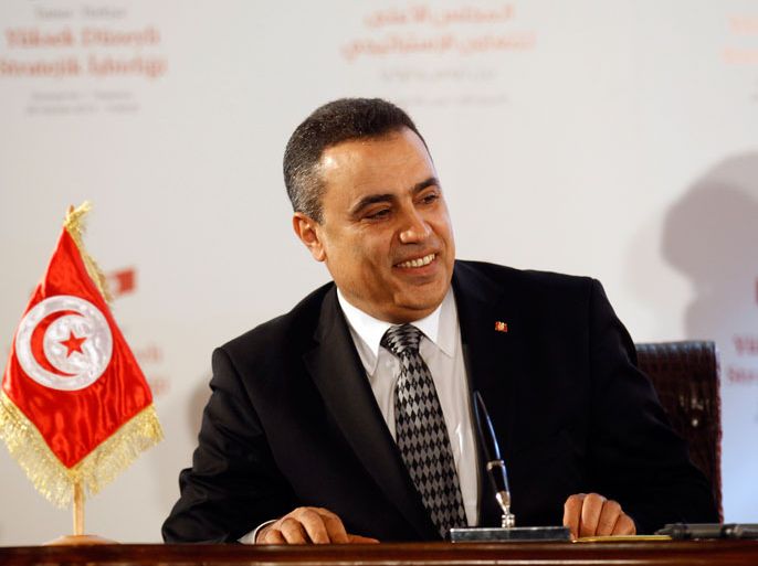 epa03991898 A photograph made available on 15 December 2013 shows the then Tunisian Industry Minister Mehdi Jomaa smiling during an event in Tunis, Tunisia, 06 June 2013. Media reports said the largest Tunisian political parties agreed late 14 December on Mehdi Jomaa to be caretaker prime minister, at the head of a transitional government. The 51-year-old engineer, who previously served as Tunisia's industry minister, will hold the post until elections slated for next year. EPA/STR