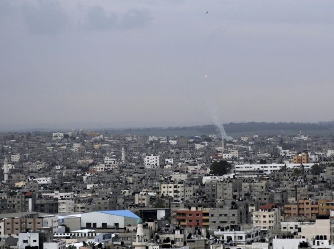 A trail of smoke from rockets fired by Palestinian militants from Gaza toward Israel is seen above Gaza City on Wednesday, March 12, 2014. The militant group Islamic Jihad in Gaza said it fired 20 rockets toward Israel on Wednesday, in retaliation for an Israeli airstrike that killed three of its members the day before. (AP Photo/Adel Hana)