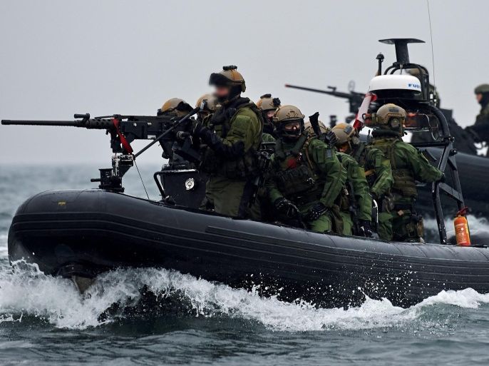 Maritime Special Forces unit soldiers from Poland, Norway and Finland take part in the International Special Forces exercises 'Cobra-13' at the Gdansk Bay in Gdynia, Poland, 20 November 2013. More than 2,000 commando soldiers from 15 NATO and EU member states take part in this year's biggest allied special forces maneuvers in Poland, Lithuania, the Czech Republic and Slovakia. (EDITORS NOTE: Faces blurred due to protection of the Special Forces soldiers) EPA/ADAM WARZAWA POLAND OUT