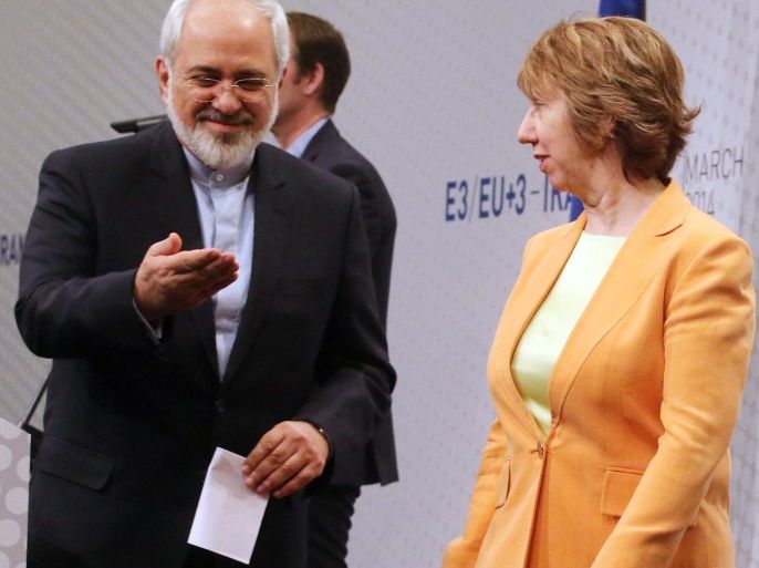 European foreign policy chief Catherine Ashton, left, and Iranian Foreign Minister Mohamad Javad Zarif, right, leave a news conference after closed-door nuclear talks in Vienna, Austria, Wednesday, March 19, 2014. They said the talks addressed Iran's uranium enrichment program, a nearly finished nuclear reactor and the lifting of sanctions on Iran that have been imposed successively over the past decade as Tehran expanded its atomic activities. The talks will resume April 7 in Vienna. (AP Photo/Ronald Zak)