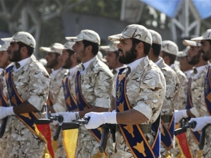 In this Sept. 22, 2011 photo, members of Iran's Revolutionary Guard march in front of the mausoleum of the late Iranian revolutionary founder Ayatollah Khomeini, just outside Tehran, Iran, during armed an forces parade marking the 31st anniversary of the start of the Iraq-Iran war. Among the many mysteries inside Iran's ruling hierarchy, the Quds Force, which sits atop the vast military and industrial network of the Revolutionary Guard, has a special place in the shadows.