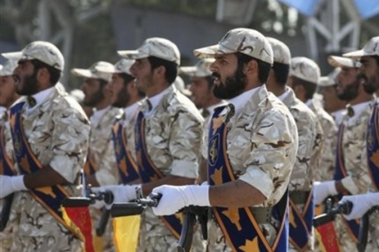 In this Sept. 22, 2011 photo, members of Iran's Revolutionary Guard march in front of the mausoleum of the late Iranian revolutionary founder Ayatollah Khomeini, just outside Tehran, Iran, during armed an forces parade marking the 31st anniversary of the start of the Iraq-Iran war. Among the many mysteries inside Iran's ruling hierarchy, the Quds Force, which sits atop the vast military and industrial network of the Revolutionary Guard, has a special place in the shadows.
