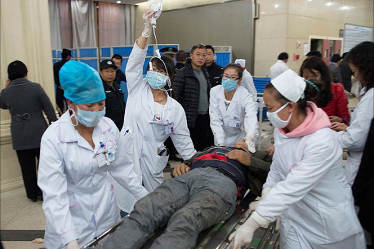 An injured man is pushed at a hospital after a knife attack at Kunming railway station, Yunnan province, March 1, 2014. Witnesses to chilling violence at a Chinese train station placed under heavy security on Sunday recalled moments of fear and chaos after at least 29 people were killed in what authorities called a terrorist attack by Xinjiang militants. Picture taken March 1, 2014. REUTERS/Stringer (CHINA - Tags: CIVIL UNREST CRIME LAW) CHINA OUT. NO COMMERCIAL OR EDITORIAL SALES IN CHINA