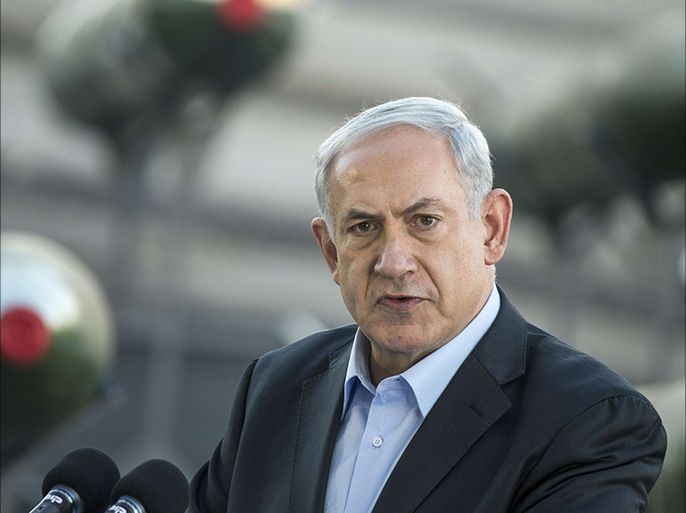 Israeli Prime Minister Benjamin Netanyahu speaks to the press at southern Israeli port of Eilat, on March 10, 2014, as Israel displayed advanced rockets type M-302 that were unloaded from the Panamanian-flagged Klos-C vessel on March 9, 2014 in Eilat. The vessel, which was allegedly transporting arms from Iran to Gaza, was escorted into the port of Eilat after Israeli naval commandos seized it on March 5, 2014. AFP PHOTO / JACK GUEZ