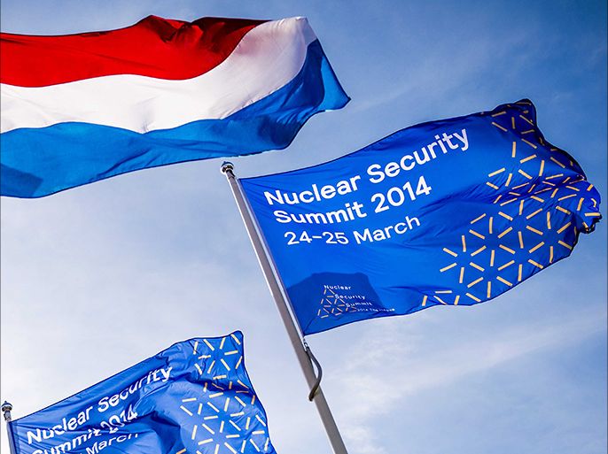 epa04134797 A photo made available 21 March 2014 shows flags outside the Expo Haarlemmermeer in Vijfhuizen that will function as a extra luggage hall for delegations arriving for the Nuclear Security Summit, in Vijfhuizen, near The Hague, The Netherlands, 20 March 2014. The Nuclear Security Summit (NSS) in The Hague, The Netherlands, is scheduled from 24 to 25 March