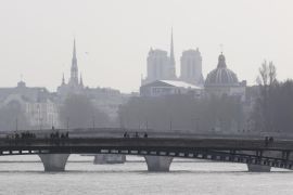 A foggy view of the Notre-Dame Cathedral on March 15, 2014 in Paris. Over 30 departments in France have exceeded the maximum warning threshold for particulate pollution, prompting the French Ecology Minister to say that the air quality was 'an emergency and a priority for the government.' AFP PHOTO / FRANCOIS GUILLOT