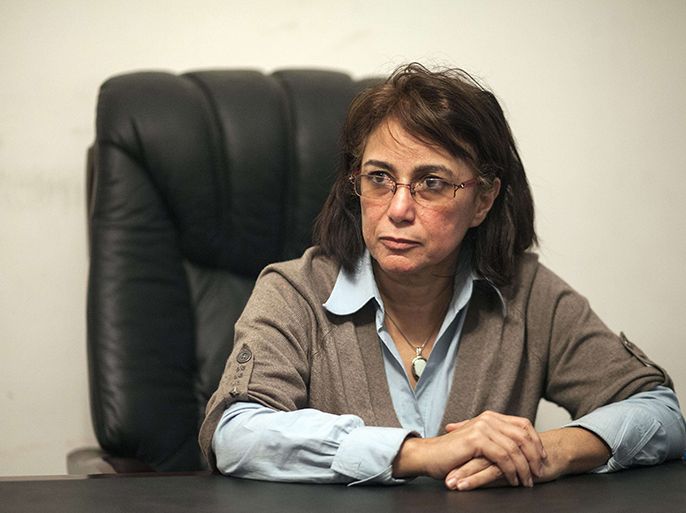 Egyptian Hala Shukrallah looks on during an interview with AFP in Cairo on March 3, 2014. Shukrallah, the first woman to head an Egyptian political party, has expressed concern that a return to military rule could threaten democracy in a country roiled by three years of turbulence. AFP
