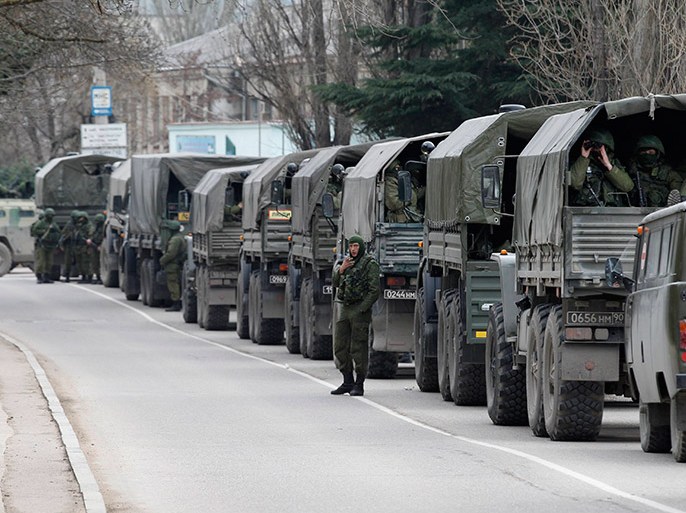 Armed servicemen wait in Russian army vehicles in the Crimean town of Balaclava March 1, 2014. Ukraine accused Russia on Saturday of sending thousands of extra troops to Crimea and placed its military in the area on high alert as the Black Sea peninsula appeared to slip beyond Kiev's control. REUTERS