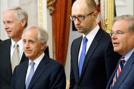 Ukraine's Prime Minister Arseniy Yatseniuk (2nd R) arrives for a meeting with members of the U.S. Senate Foreign Relations Committee, including the chairman Senator Bob Menendez (D-NJ) (R), ranking member Senator Bob Corker (R-TN) (2nd L) and Senator Ron Johnson (R-WI) (L) at the U.S. Capitol in Washington March 12, 2014. REUTERS/Jonathan Ernst (UNITED STATES - Tags: POLITICS)