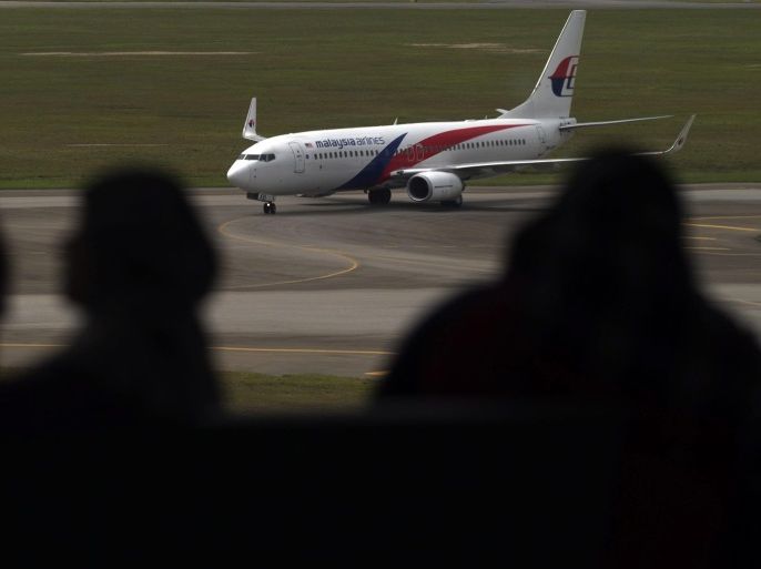 A Malaysia Airlines aircraft is seen at Kuala Lumpur International Airport (KLIA) in Sepang outside Kuala Lumpur, Malaysia, 09 September 2013. According to reports, Malaysian authorities fined Malaysia Airlines and AirAsia 2.29 million euros on 06 September for allegedly breaching competition laws when they collaborated under a share-swap deal in August 2011.