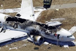 FOR USE AS DESIRED, YEAR END PHOTOS - FILE - This aerial photo shows the wreckage of the Asiana Flight 214 airplane after it crashed at the San Francisco International Airport in San Francisco, Saturday, July 6, 2013. (AP Photo/Marcio Jose Sanchez, File)
