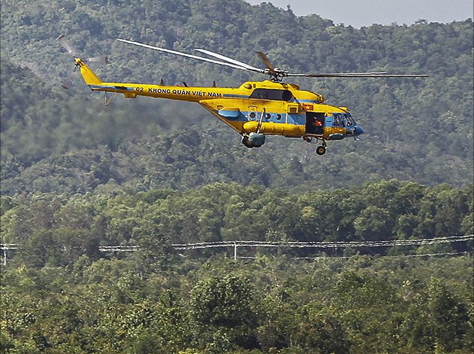 A Vietnamese Air Force helicopter takes off for a search and rescue mission for the missing Malaysia Airlines (MAS) flight MH370 off Vietnam's southern coastline, at a military base on the southern island of Phu Quoc on March 10, 2014. Mystery deepened on March 10 over the fate of a Malaysian jet carrying 239 people, as tests on oil slicks scotched suspicions it was aircraft fuel while the search for debris failed to yield any trace of the missing aircraft. AFP PHOTO/LE QUANG NHAT