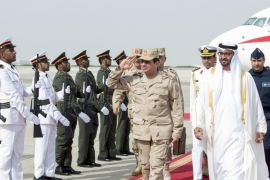 Abu Dhabi's Crown Prince Sheikh Mohammed bin Zayed al-Nahyan (R) and Egypt's army chief Field Marshal Abdel Fattah al-Sisi (2nd R) review the honor guard upon Sisi's arrival to Abu Dhabi March 11, 2014. REUTERS/Emirates News Agency/WAM/Handout via Reuters (UNITED ARAB EMIRATES - Tags: POLITICS ROYALS) ATTENTION EDITORS - NO SALES. NO ARCHIVES. FOR EDITORIAL USE ONLY. NOT FOR SALE FOR MARKETING OR ADVERTISING CAMPAIGNS. THIS IMAGE HAS BEEN SUPPLIED BY A THIRD PARTY. IT IS DISTRIBUTED, EXACTLY AS RECEIVED BY REUTERS, AS A SERVICE TO CLIENTS