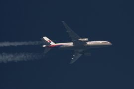 Boeing 777 Malaysian Airlines Flight MH370 with the registration number 9M-MRO flies over Poland February 5, 2014. Malaysia Airlines Flight MH370, with 239 people on board, dropped off air traffic control screens at about 1:30 a.m. on March 8, 2014, less than an hour into a flight from Kuala Lumpur to Beijing. There were no reports of bad weather or mechanical problems. Picture taken February 5, 2014. REUTERS/Tomasz Bartkowiak (POLAND - Tags: TRANSPORT DISASTER)