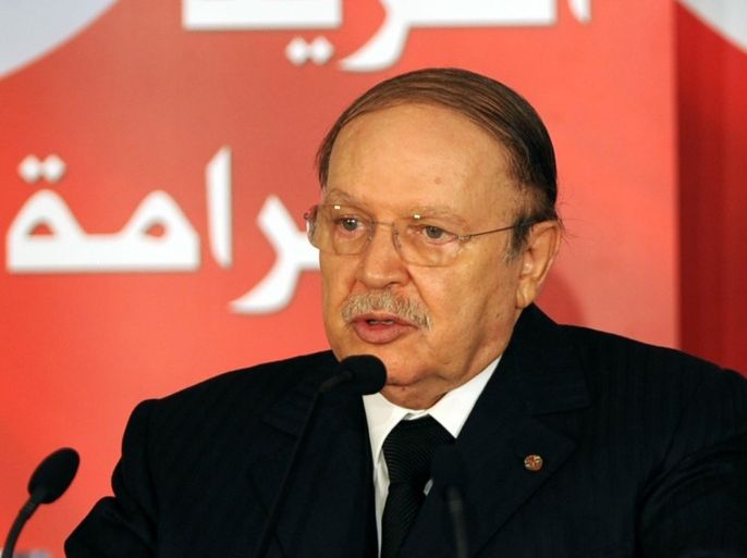 Algerian President Abdelaziz Boutaflika delivers a speech marking the anniversary of dictator Zine El Abidine Ben Ali's departure on January 14, 2012 in Bourguiba Avenue, in Tunis. Earlier today, thousands of Tunisians, many of them wearing the red and white of the national flag, turned out in central Tunis calling for jobs and dignity. They brandished banners and chanted 'Work, freedom and dignity' as they marched down Bourguiba Avenue, which was the epicentre of the uprising that effectively launched the Arab Spring.