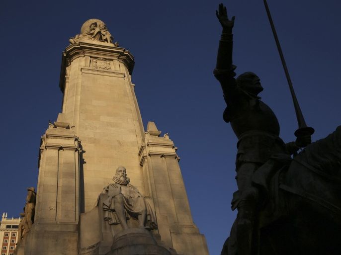 The statue of Miguel de Cervantes, one of Spain's most important literary figures, is seen next to the statue of one of his most famous characters, Don Quixote, from his famous novel at the monument in his honour at Plaza de Espana square in central Madrid March 7, 2014. Historian Fernando Prado says he is not just tilting at windmills in his quest to find the remains of Spanish novelist Miguel de Cervantes, the creator of "Don Quixote". Almost 400 years after Cervantes's death, Prado is set to use ground-penetrating radar to peer into the sub-soil beneath an old convent in the heart of Madrid to look for his remains. A dozen elderly nuns cloistered in the 17th Century walled convent have agreed to the search, which will start next month. Born in 1547, Cervantes was buried in Madrid after his death in 1616 - the same week in which William Shakespeare died. Picture taken March 7, 2014. REUTERS/Susana Vera (SPAIN - Tags: SOCIETY ENTERTAINMENT)