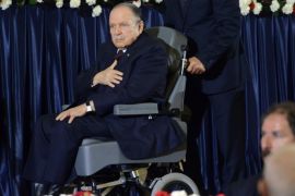 Algerian President Abdulaziz Bouteflikz is pushed in his wheelchair as he arrives for his inauguration ceremony as he is sworn as Algeria's President for a fourth term in Algiers on April 28, 2014. Official results showed that Bouteflika won 81.5 percent of the votes in an election marred by low turnout and claims of fraud by his opponents, including main rival Ali Benflis, who received just 12.18 percent. AFP PHOTO / FAROUK BATICHE