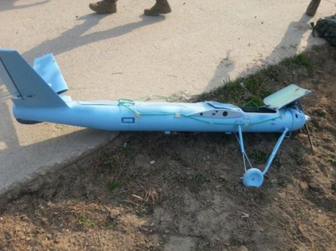 A crashed unmanned drone is seen on Baengnyeongdo, an island near the border with North Korea in this picture provided by the Defense Ministry and released by Yohnap on April 1, 2014. A South Korean military inquiry into a drone found on a border island has concluded that North Korea flew the unmanned aircraft to conduct reconnaissance missions, a media report said. Picture taken April 1, 2014. REUTERS/Yonhap (SOUTH KOREA - Tags: MILITARY TRANSPORT POLITICS) ATTENTION EDITORS - THIS PICTURE WAS PROVIDED BY A THIRD PARTY. NO SALES. NO ARCHIVES. FOR EDITORIAL USE ONLY. NOT FOR SALE FOR MARKETING OR ADVERTISING CAMPAIGNS. SOUTH KOREA OUT. NO COMMERCIAL OR EDITORIAL SALES IN SOUTH KOREA. THIS PICTURE IS DISTRIBUTED EXACTLY AS RECEIVED BY REUTERS, AS A SERVICE TO CLIENTS