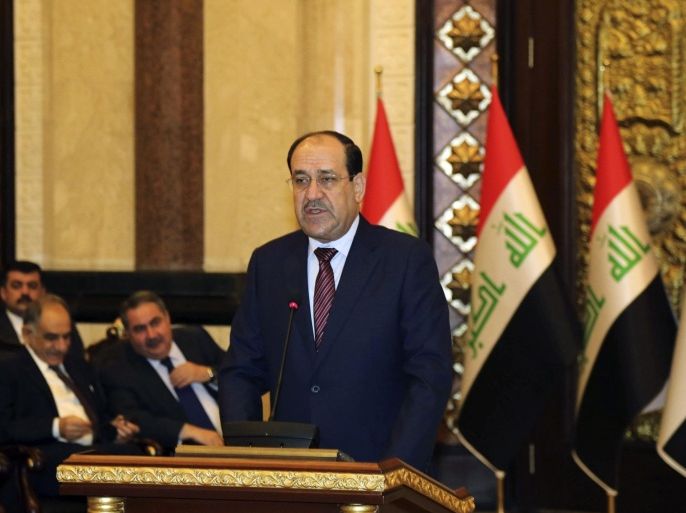 Iraqi Prime Minister Nouri al-Maliki speaks at the opening day of a counter-terrorism conference in Baghdad, March 12, 2013. REUTERS/ Karim Kadim/Pool (IRAQ - Tags: POLITICS CIVIL UNREST)