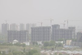 BEIJING, CHINA - APRIL 09: A general view of buildings surrounded by smog on April 9, 2014 in Beijing, China. China is vowing to ammend its procedures to curb pollution as smog in some areas of China have registered over 20 times the level considered safe by the World Health Organization (WHO)