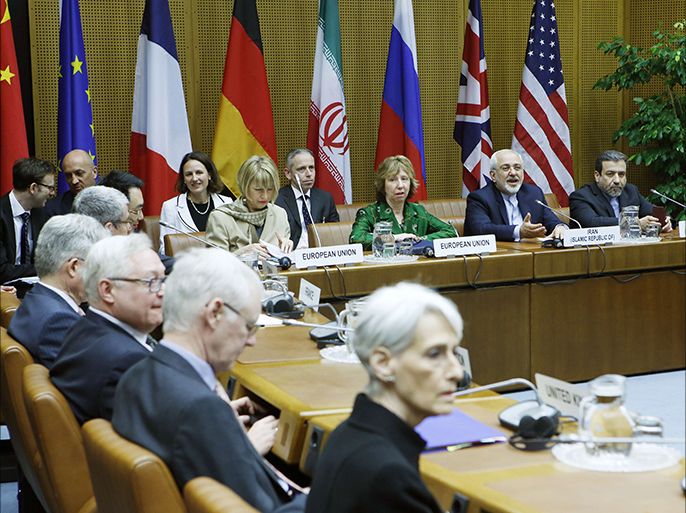 (Background, LtoR) EU Deputy Secretary General Helga Schmid, Vice President of the European Commission Catherine Margaret Ashton, Iranian Foreign Minister Javad Mohammad Zarif, and Iranian ambassador to Austria Hassan Tajik attend the socalled EU 5+1 Talks with Iran at the UN headquarters in Vienna, on April 8, 2014.Iran and world powers hold a third round of nuclear talks aimed at securing a highly ambitious lasting agreement by July, as they seek to end a decade-old standoff over the Iranian nuclear programme. AFP PHOTO/DIETER NAGL