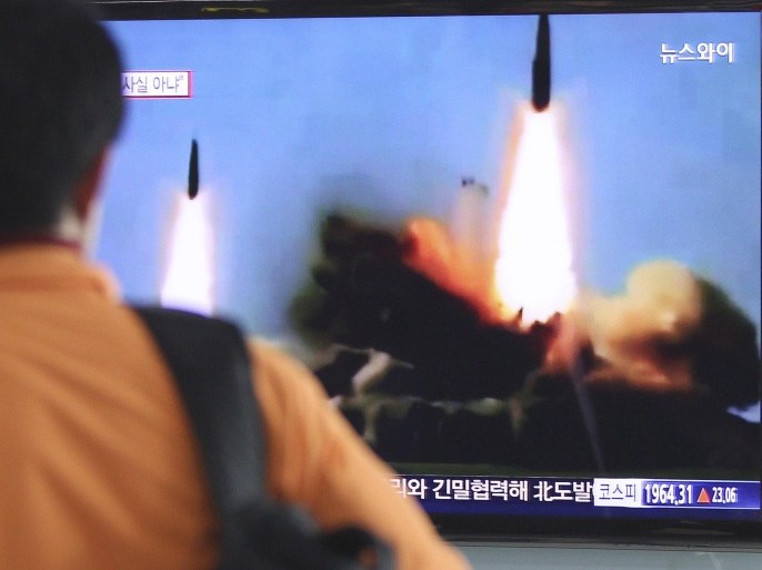 A man watches a TV news program showing the missile launch conducted by North Korea, at Seoul Railway Station in Seoul, South Korea, Wednesday, March 26, 2014. North Korea test-fired two medium-range ballistic missiles on Wednesday, South Korea and the U.S. said, a defiant challenge to a rare three-way summit of its rivals Seoul, Tokyo and Washington that focused on the North's security threat.(AP Photo/Ahn Young-joon)