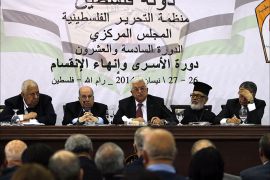 Palestinian Authority President Mahmud Abbas (C) gives a speech to members of the Palestine Liberation Organisation (PLO)'s Central Council during a meeting in the West Bank city of Ramallah on April 26, 2014. Palestinians will never recognise Israel as the "Jewish state," Abbas said, as his leadership convened to chart a course of action after Israel halted peace talks. "In 1993 we recognised Israel," Abbas told members of the PLO, adding that the Palestinians should not be forced to go a step further and recognise Israel's religious identity. AFP PHOTO / ABBAS MOMANI